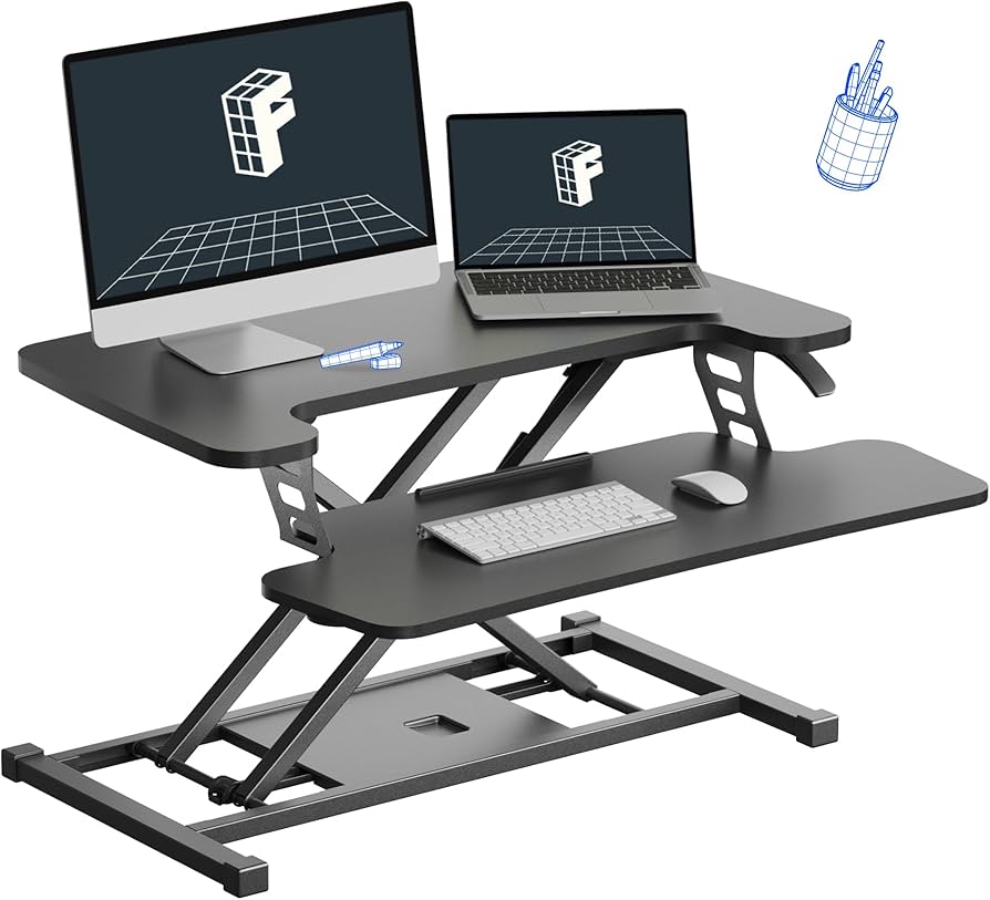 Black sit-stand converter showing dual monitor setup