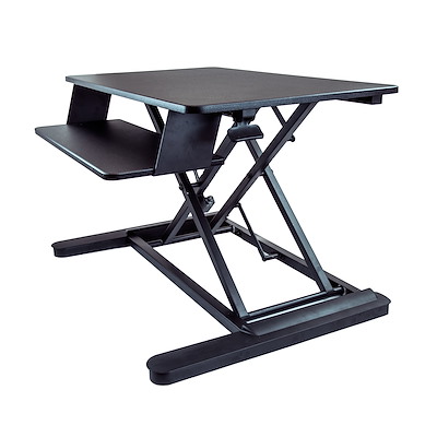 Standing desk converter with adjustable height mechanism