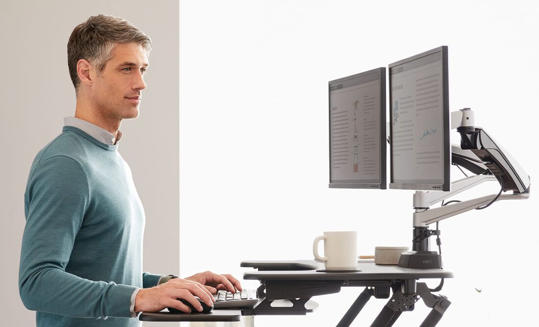 Adjustable standing desk with dual monitor setup